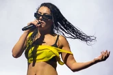Charli XCX soaking wet in teeny boxers and little else as as crop top slips off