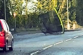 Watch as trampoline crashes across dual carriageway as driver says 'I was so scared'