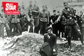 Nazi executioner in one of the Holocaust's most harrowing pictures is finally unmasked