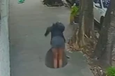 Woman rushed to hospital after falling down manhole when men 'tried to steal cover'