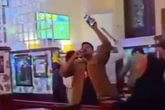 Machete thug pushes past karaoke pub punters before hacking man 'enjoying pint'
