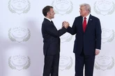 Donald Trump's 5-word threat to Emmanuel Macron during tense handshake