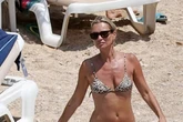Kate Moss, 47, unleashes ageless beauty as she sizzles in skimpy leopard print bikini