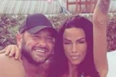 Katie Price spills over busty bikini as she gets handsy with Lee Andrews in pool
