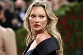 Kate Moss 'back to her old partying ways' as she 'necks lager backstage at festival'