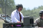 King Charles hops in a battle tank after 'withdrawing' Prince Harry's Palace invite