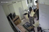 Terrifying moment man climbs through woman's kitchen window with knife