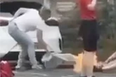 Horror as woman catches fire in UK street as passers by try frantically to help
