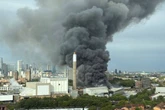 Black smoke billows across London as 100 firefighters battle huge blaze near tube