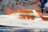 Superyacht bursts into flames and sinks off coast of holiday hotspot