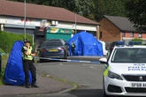 Machete-wielding gang in forensic suits told shopkeeper 'you are going to die here'