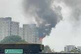 Huge blaze as 70 firefighters rush to tackle flames and smoke billowing from block