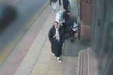 Three women hug and kiss pensioner in street but something more sinister is going on