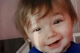 Tragic tot 'beaten to death by grandparents' while mum was upstairs on her phone