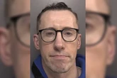 Convicted paedo ex-cop dressed as elf and posed with Santa in Christmas grotto