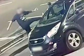 Shocking moment stranger attacks woman's car in Birmingham street 'for the fun of it'