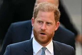 Prince Harry's stalker 'body blocked' by guards as she makes a beeline for him twice
