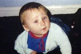 Dad who beat his own baby to death sparks fury by visiting grave after jail release
