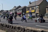 'Biker gang' terrorises quiet UK town as shocking footage shows gang popping wheelies