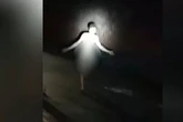 Watch naked man stride down busy road in pitch black as woman describes her 'terror'