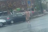 Naked man attacks motorists and tries to pull driver from van in terrifying footage
