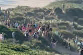 Screams as party erupted into violent chaos after teen boy 'stabbed on beach'