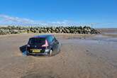 Rescue mishap on Cleethorpes beach leaves car submerged and tow truck stuck