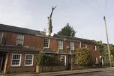 UK's most famous house with 25ft shark sticking out of roof is back on market to rent