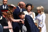 Kate Middleton's response to Macron's 'gallant' kiss as husband snubbed in 'shove' video