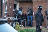 Bloodied man led away in dramatic Greater Manchester counter-terror operation