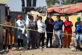 Mass shooting horror as 13 slaughtered after group of masked gunmen open fire