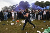 Oasis fans 'throw camping chairs and bottles' as they scrap on 'Gallagher Hill'