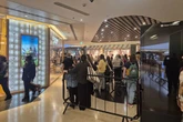 Excited shoppers form a big queue at Grand Central for one reason