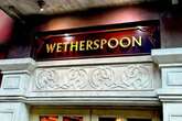 Wetherspoons introduces £3 charge across more than 650 pubs in UK