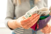 DWP handing people on six benefits free £150 payment in October