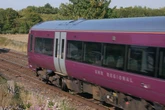 Passenger says train delayed by 'people being lowered over bridges to put flags up'