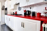 Coca-Cola themed house for sale - complete with branded fridge and fireplace