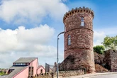 Britain's smallest castle with bath under bed goes on sale for £330,000