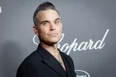 Robbie Williams snapped in Birmingham as he meets city 'legend'