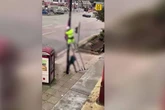 Worker 'assaulted' as man 'pulls ladder away' from lampost in 'flag row'