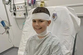 Hero boy, 11, hit in head by firework after throwing himself in way of baby sister