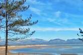 The UK's 'most beautiful' beach that has clear blue sea and is surrounded by mountains