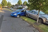 Car ploughs into parked vehicles along notorious road