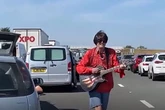 Watch 'Neil Diamond' serenade gridlocked traffic with Sweet Caroline on jammed road
