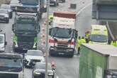 M6 motorway crash live – delays near Birmingham after lorries and a van collide