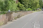 Pensioner attacked on village bridge in broad daylight as police launch probe