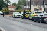 Armed police raid Sutton Coldfield home shutting down main road as firearms arrest made
