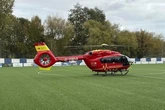 Air ambulance lands on football pitch after man falls from 'ladder'