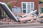 Residents on danger junction call for protection as cars written off and gardens destroyed