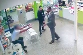 Moment 'crazed man high on monkey dust' tackled to the ground by hero pharmacy staff